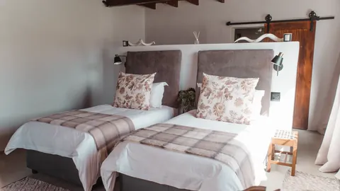 A comfortable guest bedroom at Whytebank Chase