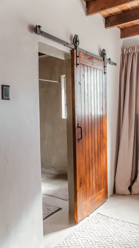 A timber door and passage inside the farmhouse