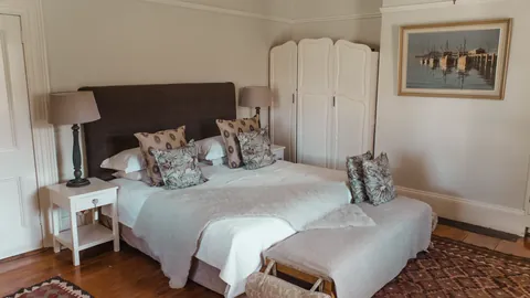 A warmly furnished farmhouse bedroom