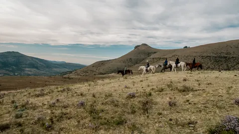 Riders travelling across the high country