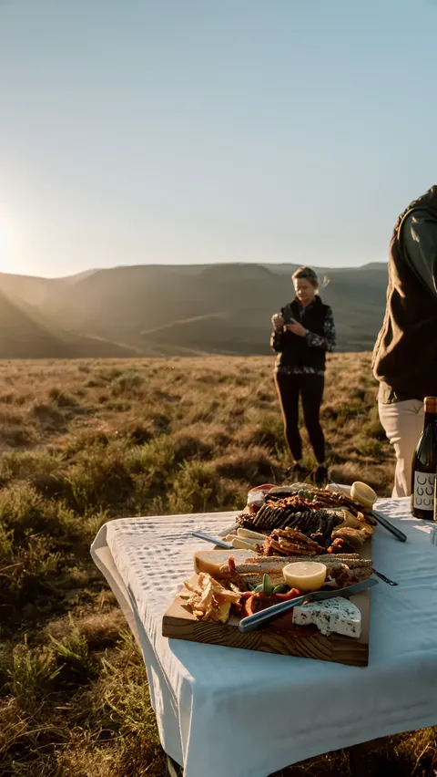 A country table prepared outdoors in the valley
